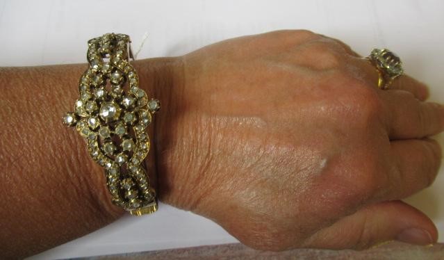 A DIAMOND STIFF HINGED BANGLE Image