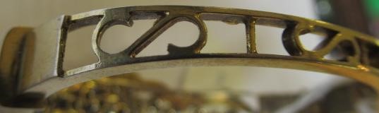 A DIAMOND STIFF HINGED BANGLE Image