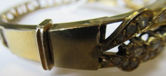 A DIAMOND STIFF HINGED BANGLE Image