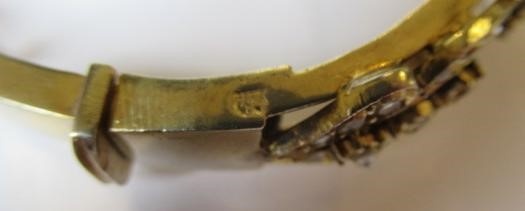 A DIAMOND STIFF HINGED BANGLE Image