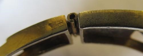 A DIAMOND STIFF HINGED BANGLE Image