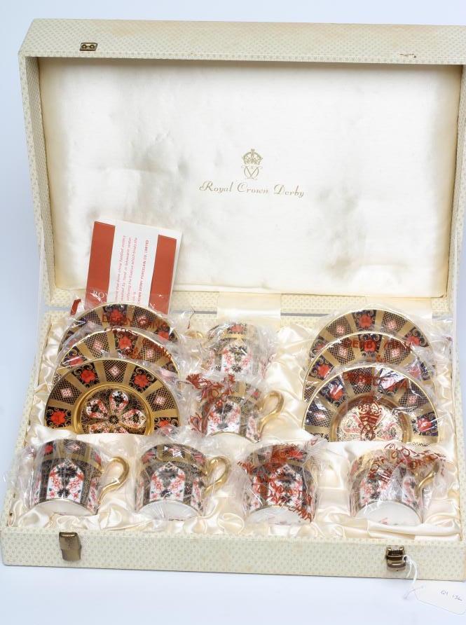 A ROYAL CROWN DERBY CHINA CABINET COFFEE SET, c.1974, painted in the Imari palette with pattern 1128 Image