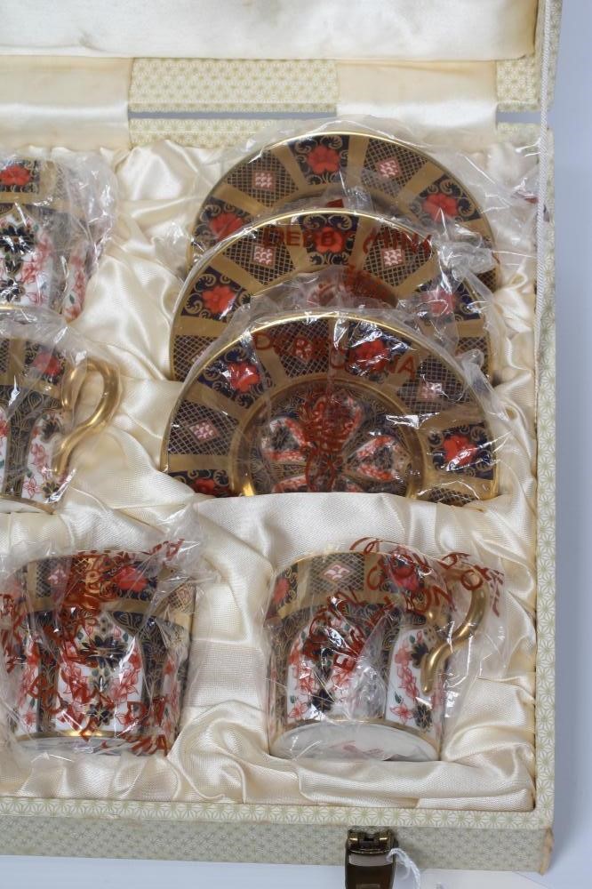 A ROYAL CROWN DERBY CHINA CABINET COFFEE SET, c.1974, painted in the Imari palette with pattern 1128 Image