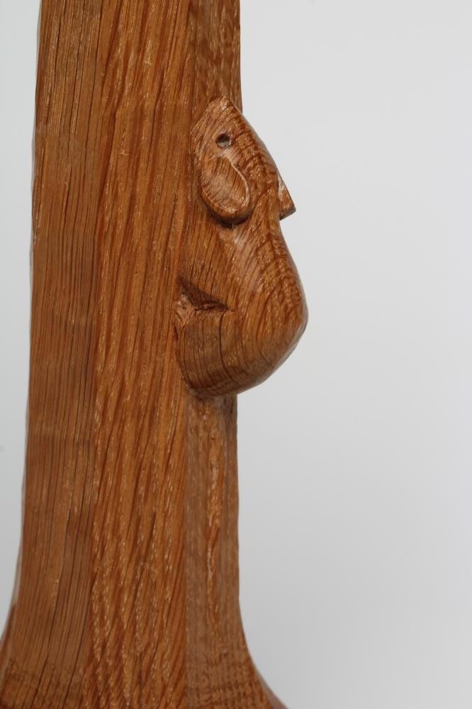 A ROBERT THOMPSON ADZED OAK TABLE LAMP of candlestick form Image