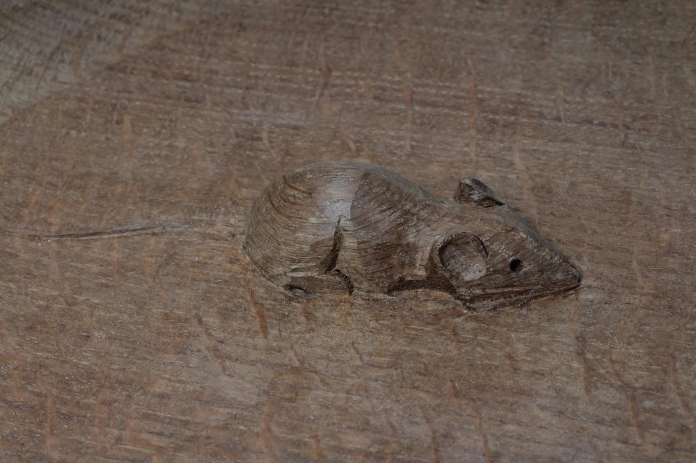 A ROBERT THOMPSON ADZED OAK FRUIT BOWL of shallow circular form with carved mouse trademark in high Image