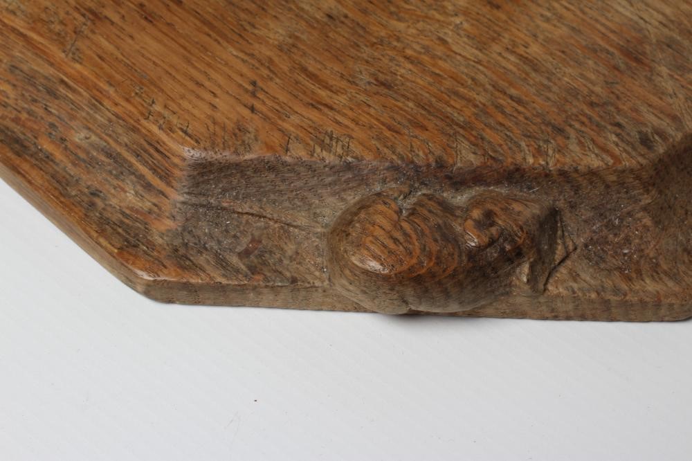 A ROBERT THOMPSON OAK BREAD BOARD of canted oblong form Image