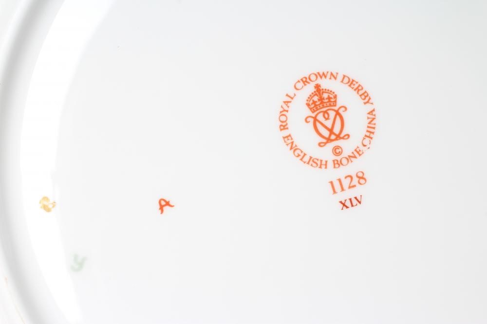 A SET OF SIX ROYAL CROWN DERBY CHINA DINNER PLATES, modern, painted in the Imari palette with Image