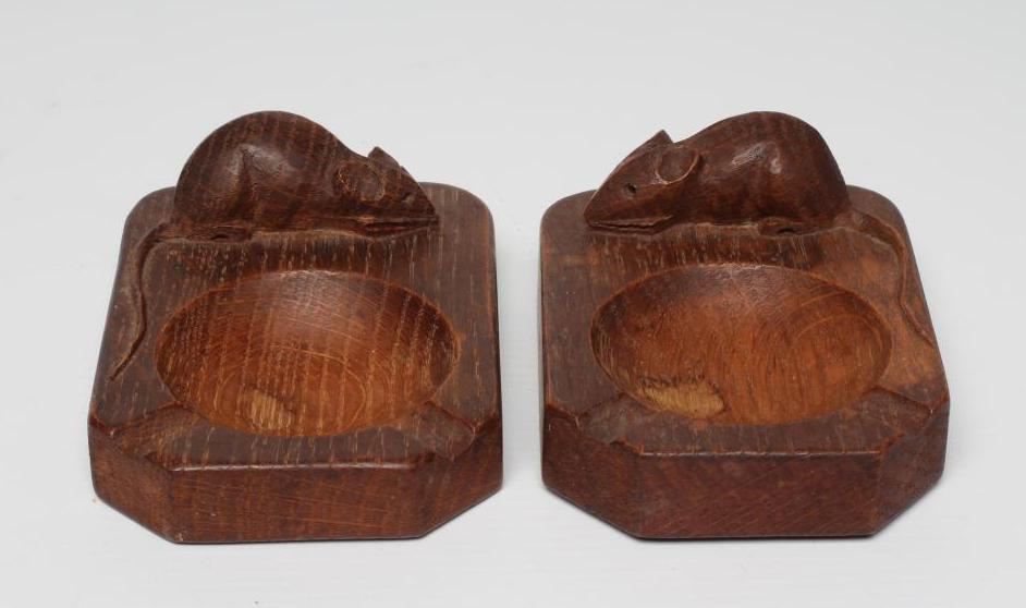 A PAIR OF ROBERT THOMPSON OAK ASHTRAYS of canted oblong form with carved mouse trademark in high Image