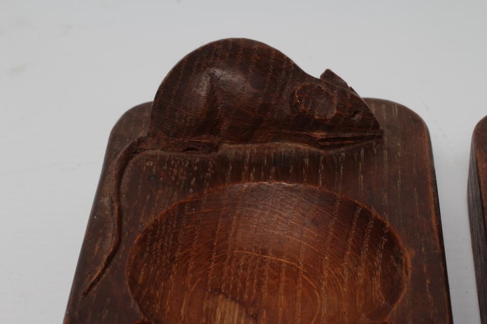A PAIR OF ROBERT THOMPSON OAK ASHTRAYS of canted oblong form with carved mouse trademark in high Image