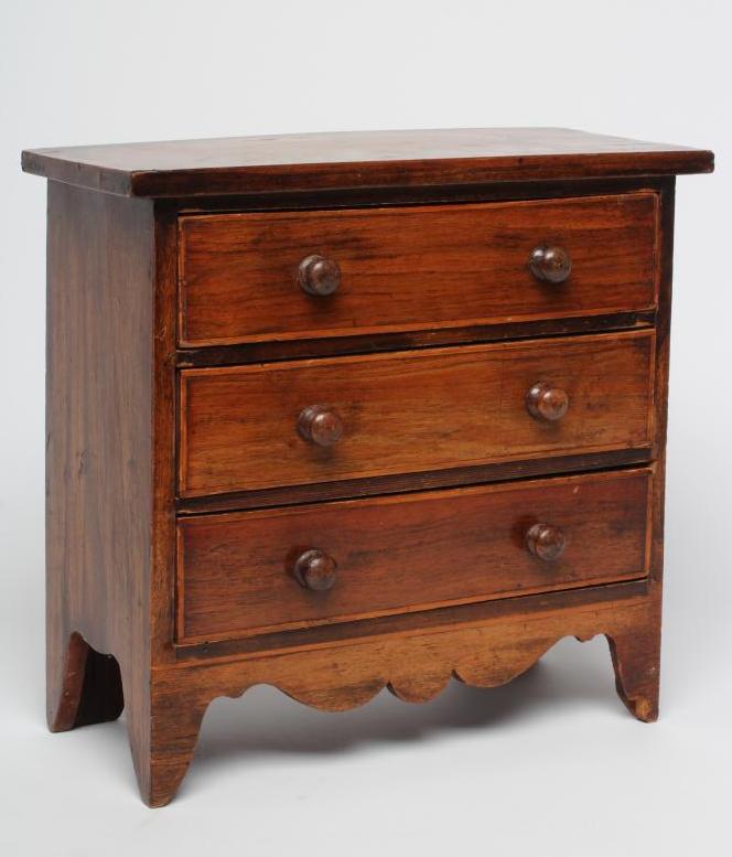 A MINIATURE MAHOGANY THREE DRAWER CHEST, 19th century, with satinwood banding and turned wood Image