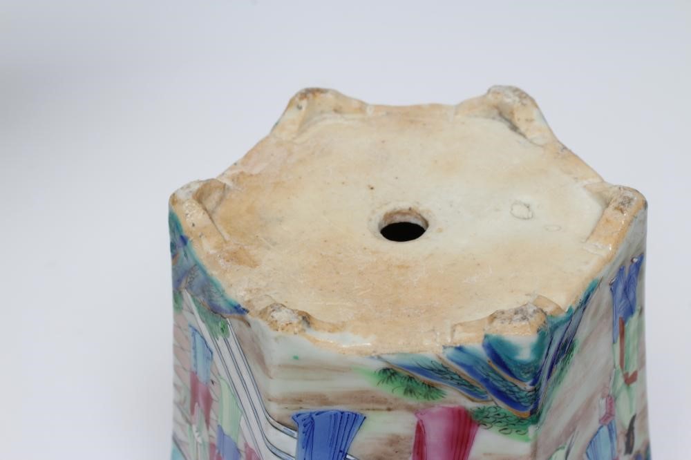 A PAIR OF CANTONESE PORCELAIN FAMILLE ROSE HEXAGONAL CACHE-POTS AND STANDS painted with a continous Image