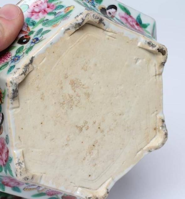 A PAIR OF CANTONESE PORCELAIN FAMILLE ROSE HEXAGONAL CACHE-POTS AND STANDS painted with a continous Image