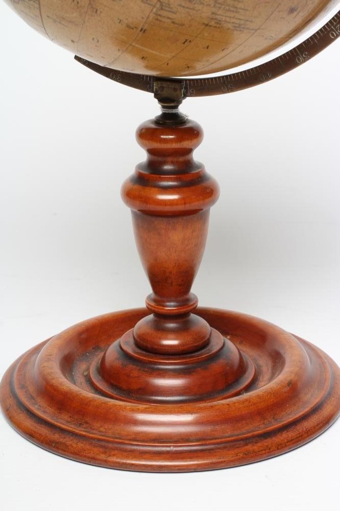 A PHILIPS 10" TERRESTRIAL TABLE GLOBE, early 20th century, raised on turned fruitwood stand (Est. Image
