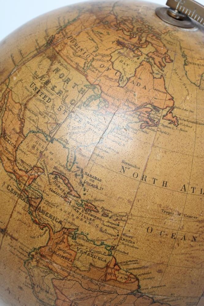 A PHILIPS 10" TERRESTRIAL TABLE GLOBE, early 20th century, raised on turned fruitwood stand (Est. Image