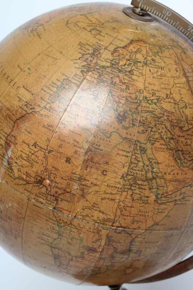A PHILIPS 10" TERRESTRIAL TABLE GLOBE, early 20th century, raised on turned fruitwood stand (Est. Image