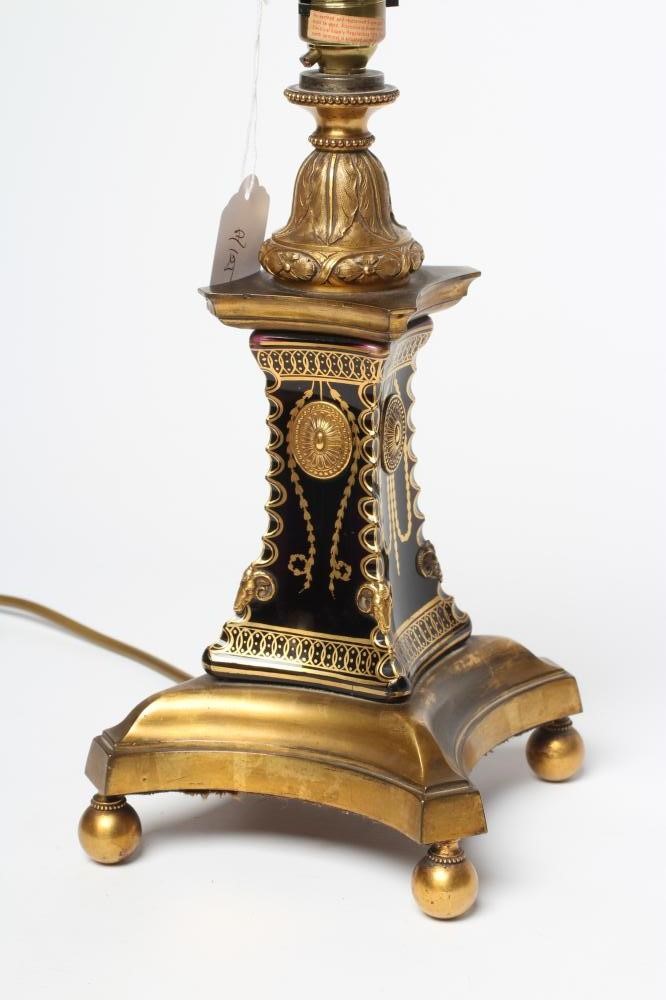 A FRENCH GILDED BRASS AND GLASS TABLE LAMP Image