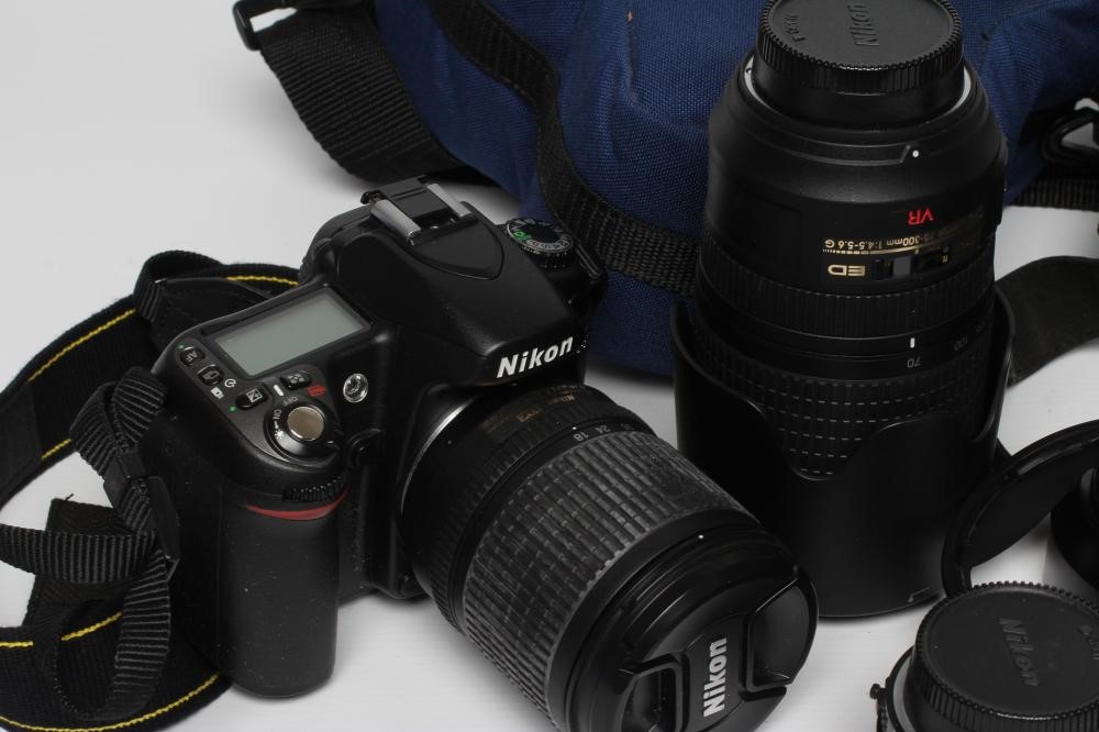 A QUANTITY OF NIKON CAMERAS AND LENSES Image
