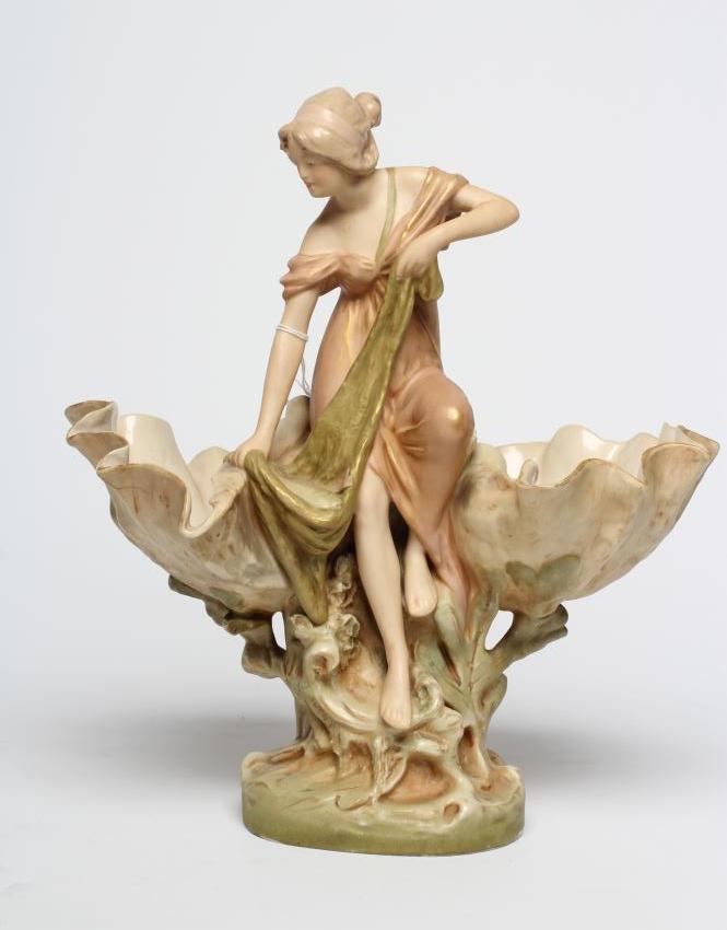 ROYAL DUX PORCELAIN ART NOUVEAU FIGURAL CENTREPIECE modelled as a young maiden standing between a Image