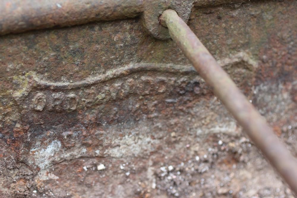A CAST IRON TROUGH of long narrow oblong form with five raised bar divides, on square section end Image