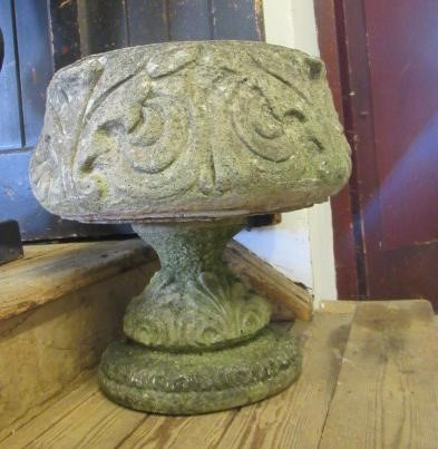 A PAIR OF CAST STONE URNS Image