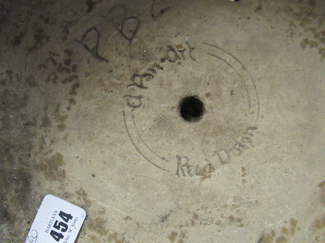 A PAIR OF CAST STONE URNS Image