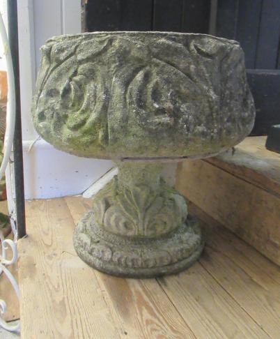 A PAIR OF CAST STONE URNS Image