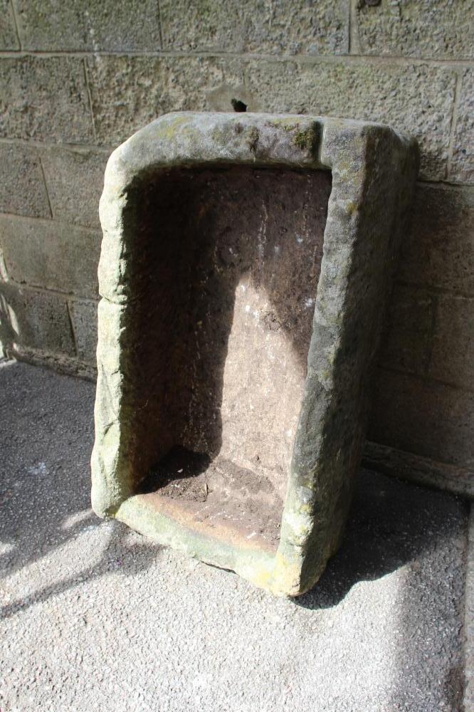 A SANDSTONE TROUGH of rough hewn oblong form, 38" x 22" x 14" (Est. plus 24% premium inc. VAT) Image