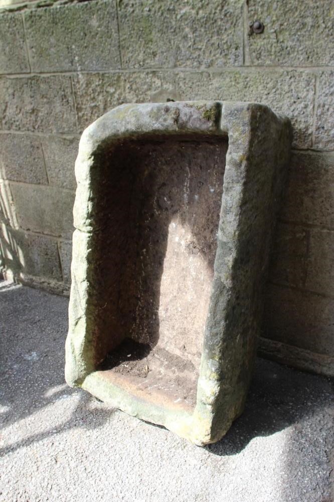 A SANDSTONE TROUGH of rough hewn oblong form, 38" x 22" x 14" (Est. plus 24% premium inc. VAT) Image
