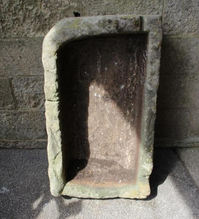 A SANDSTONE TROUGH of rough hewn oblong form, 38" x 22" x 14" (Est. plus 24% premium inc. VAT) Image