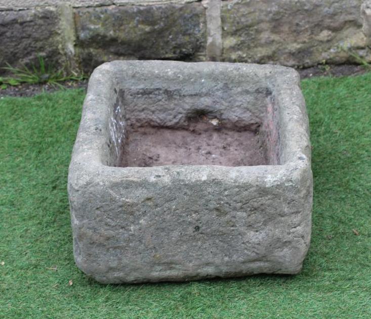 A SANDSTONE TROUGH of rough hewn square form, 20" x 19" x 10" (Est. plus 24% premium inc. VAT) Image