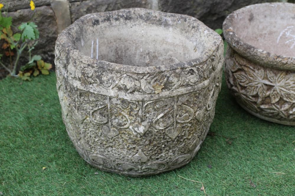 A SET OF THREE CAST STONE CIRCULAR PLANTERS with leaf moulded sides, 14 1/4" x 9", together with a Image