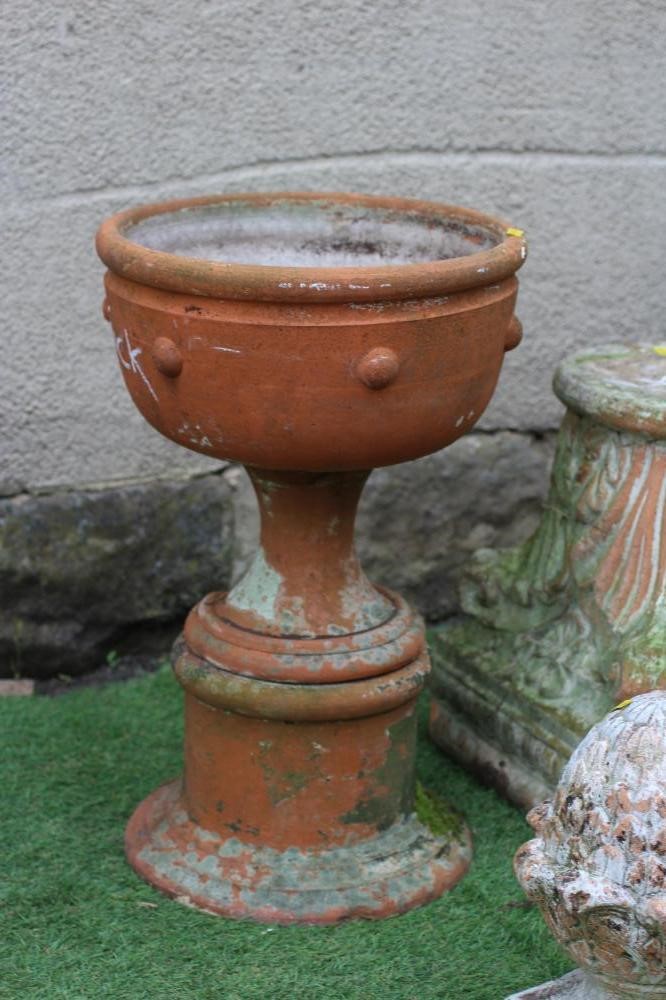 A PAIR OF TERRACOTTA URNS of plain circular form Image