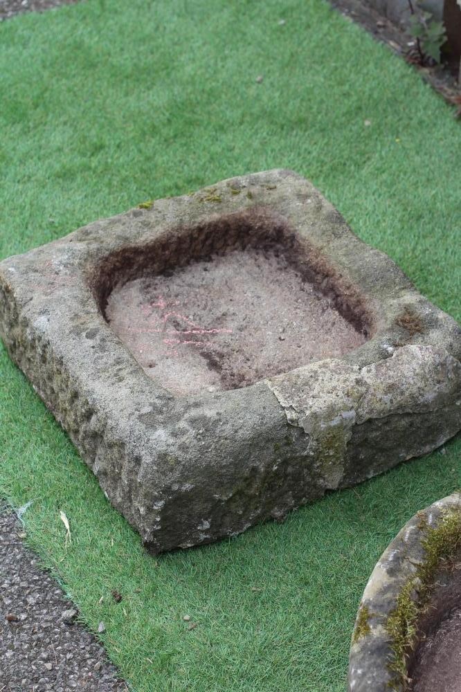 A SANDSTONE TROUGH of rough hewn D form, 25" x 15 1/2" x 5 1/2", together with a similar shallow Image