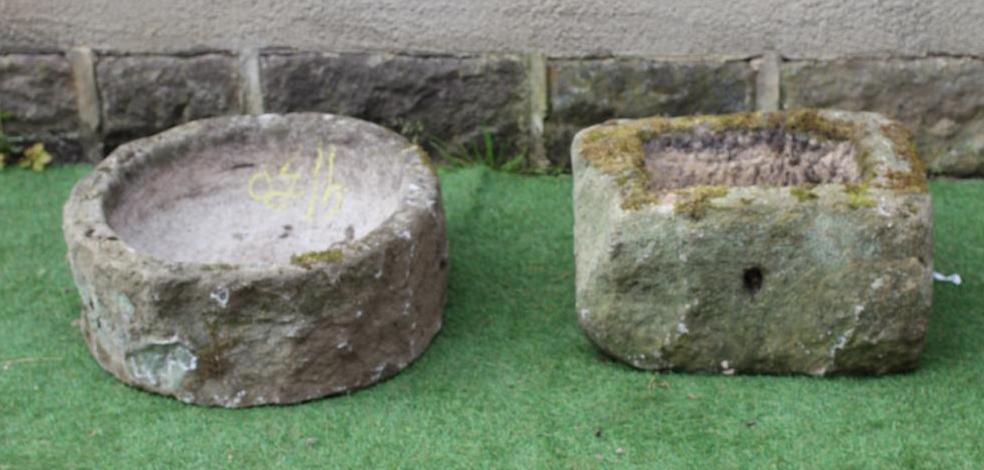 A SMALL SANDSTONE TROUGH of rough hewn circular form, 21 1/2" x 8 1/2", together with a similar Image