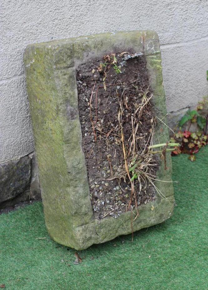 A SANDSTONE TROUGH of rough hewn oblong form, 26 3/4" x 16 3/4" x 7 3/4" (Est. plus 24% premium inc. Image