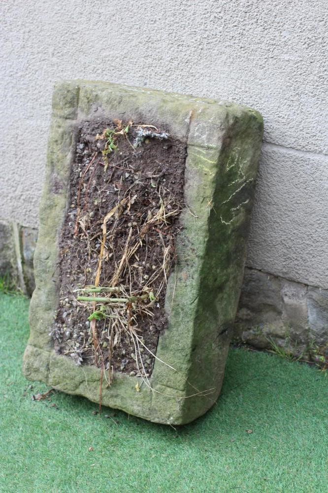 A SANDSTONE TROUGH of rough hewn oblong form, 26 3/4" x 16 3/4" x 7 3/4" (Est. plus 24% premium inc. Image