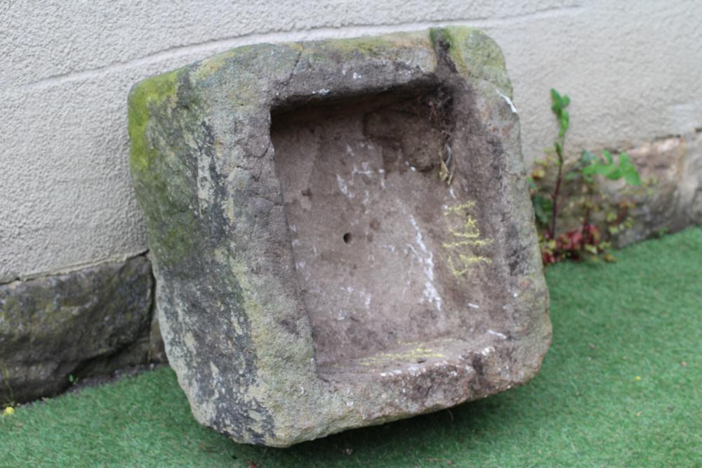 A SANDSTONE TROUGH of rough hewn square form, 22" x 20 1/2" x 11 1/2" (Est. plus 24% premium inc. Image