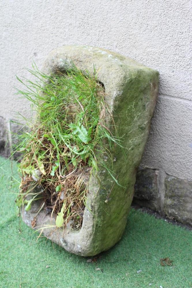 A SANDSTONE TROUGH of rough hewn oblong form, 25 1/2" x 15" x 9" (Est. plus 24% premium inc. VAT) Image