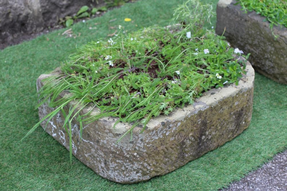 A MATCHED PAIR OF SANDSTONE TROUGHS of well cut D form, 22 1/2" x 16 1/2" x 7 1/2" (approx.) (Est. Image