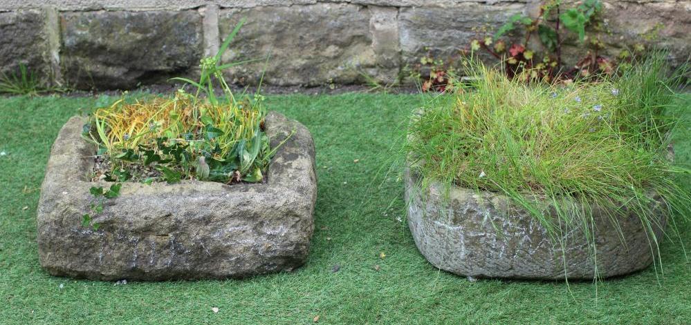A SMALL SANDSTONE TROUGH of well cut D form, 19" x 15" x 7", together with another rough hewn oblong Image