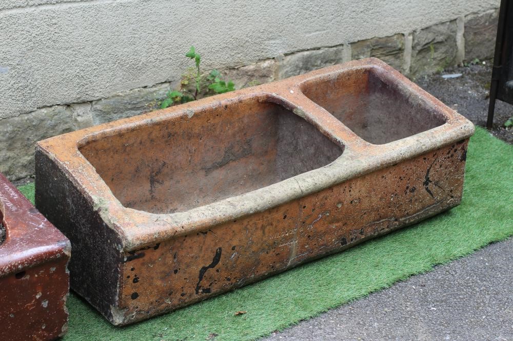 A LARGE SALT GLAZED FEEDING TROUGH of oblong form with three divisions Image