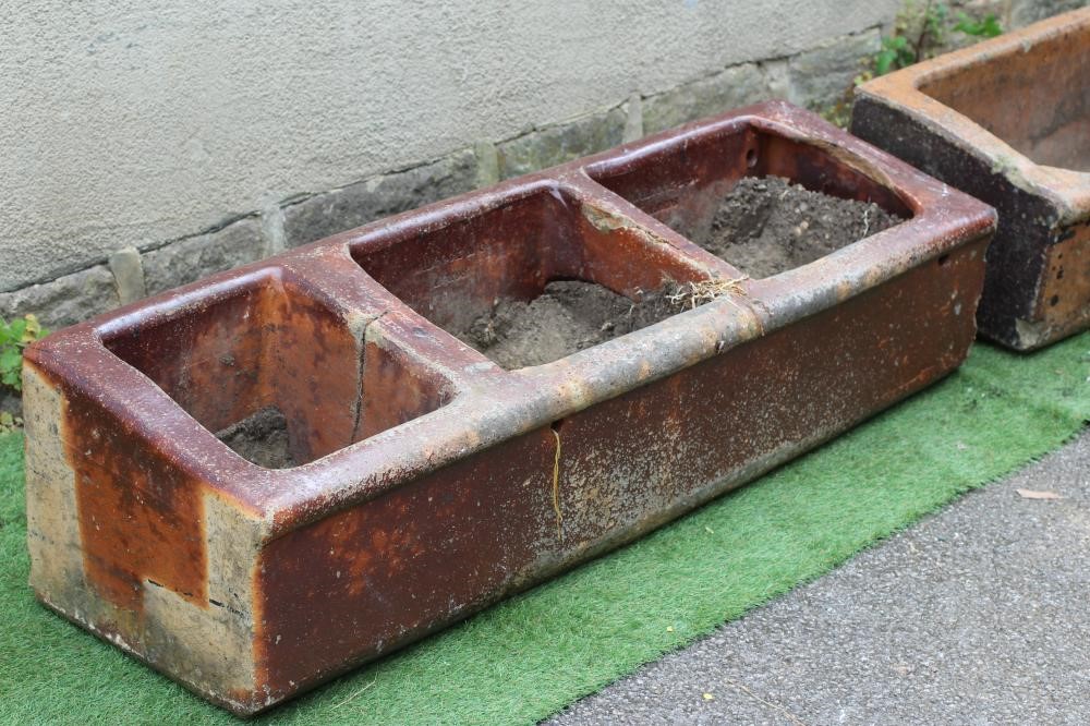 A LARGE SALT GLAZED FEEDING TROUGH of oblong form with three divisions Image