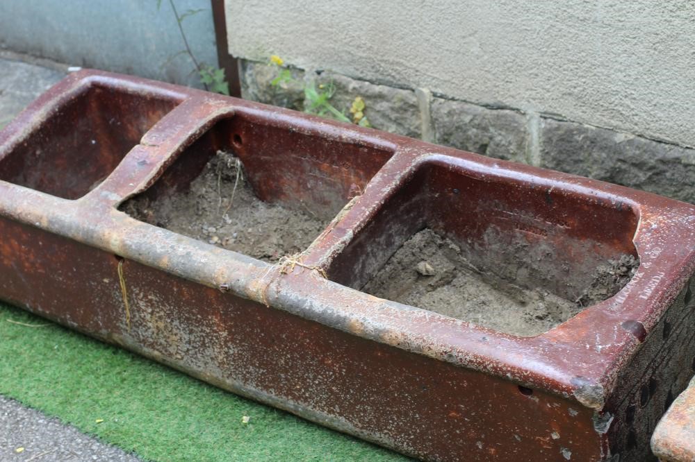 A LARGE SALT GLAZED FEEDING TROUGH of oblong form with three divisions Image