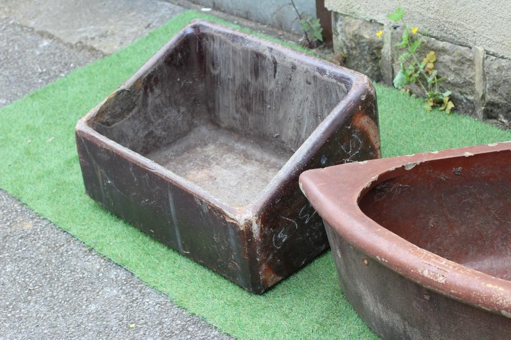 A PAIR OF SALT GLAZED FEEDING TROUGHS of sloping oblong form by The Leeds Fireclay Company Image