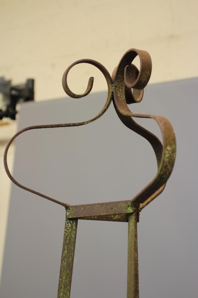 A PAIR OF HAND FORGED WROUGHT IRON OBELISKS of triangular section with scrolled finials, 90 3/4" Image