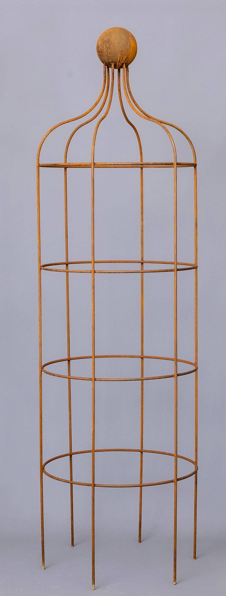 A HAND FORGED WROUGHT IRON "WINDSOR" OBELISK of cylindrical form, the top of curved outline with Image