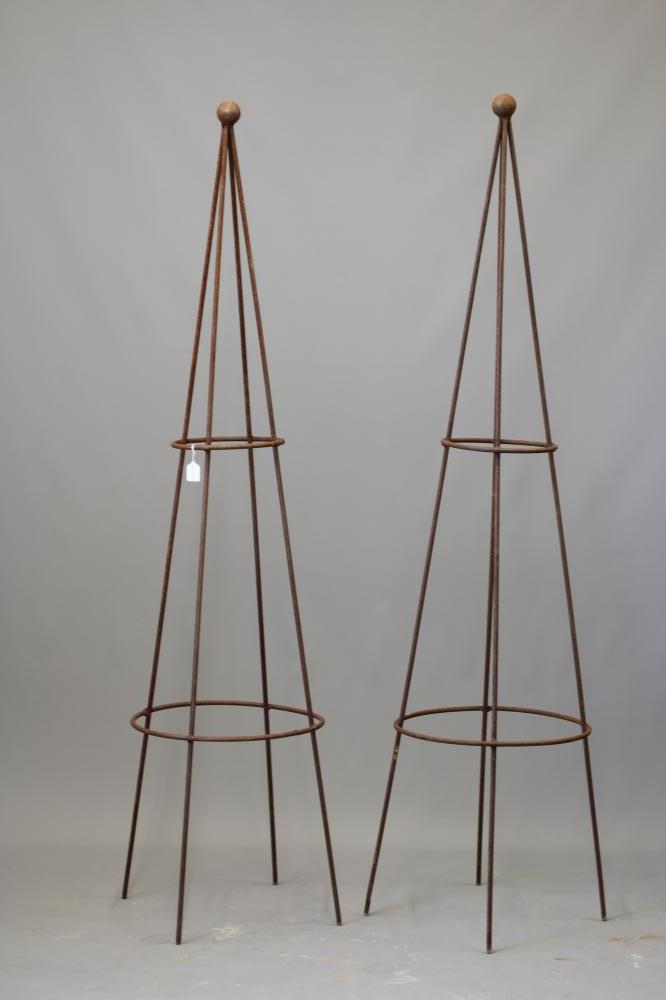 A PAIR OF HAND FORGED WROUGHT IRON OBELISKS of conical form with ball finials, 19 1/2" x 81 1/2" Image