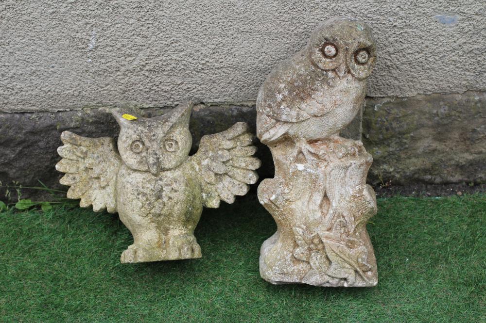 A CARVED SANDSTONE OWL, modelled resting on a tree stump and clutching a mouse in its claws, 16 1/2" Image