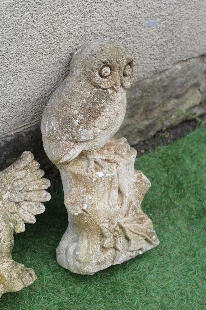A CARVED SANDSTONE OWL, modelled resting on a tree stump and clutching a mouse in its claws, 16 1/2" Image