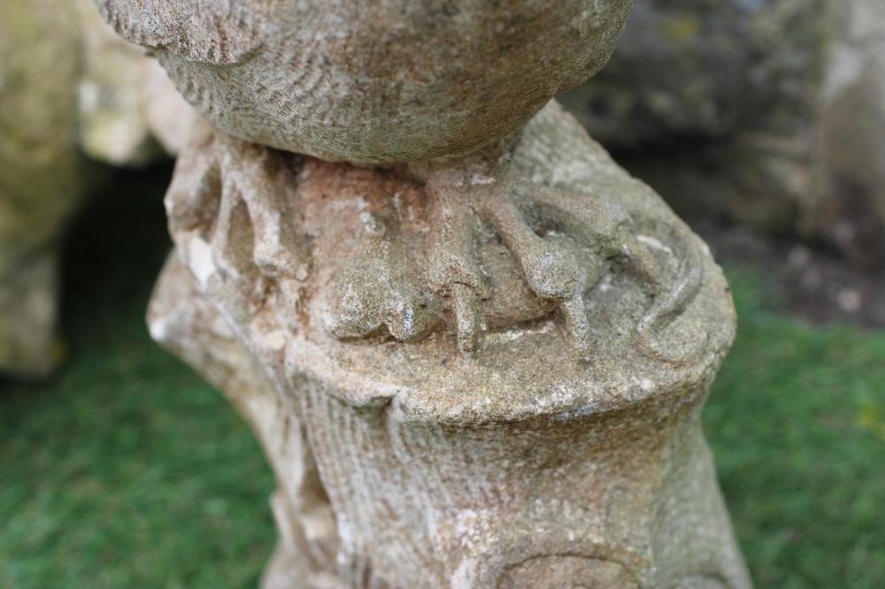 A CARVED SANDSTONE OWL, modelled resting on a tree stump and clutching a mouse in its claws, 16 1/2" Image